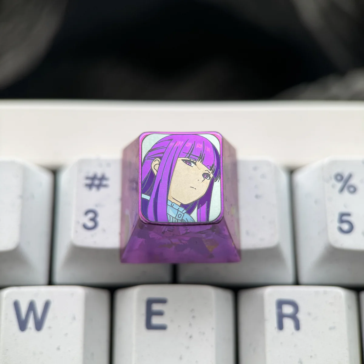 Fern titanium artisan keycap gallery: multiple angles reveal vibrant character art on polished titanium, a premium collectible for a magical.