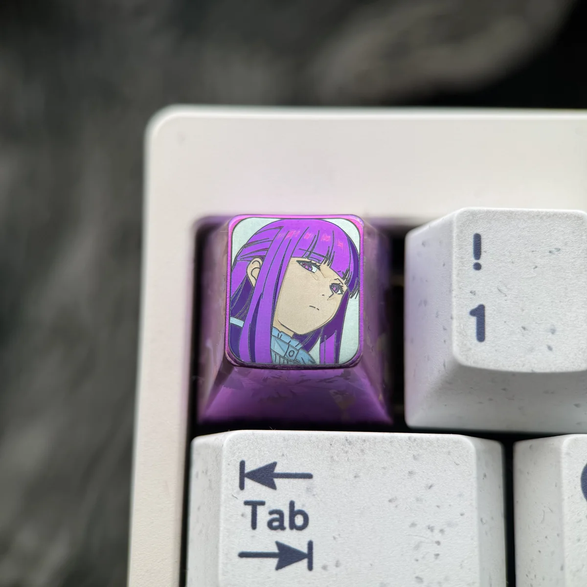 Premium Fern titanium artisan keycap featuring vibrant character art on polished metal, capturing a timeless fantasy journey.