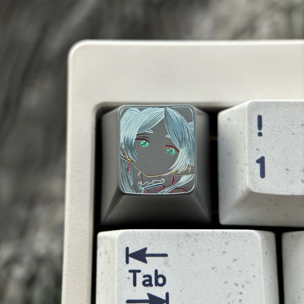 Main image of a Frieren Hand-Carved Titanium Artisan Keycap, showcasing Frieren's silhouette and intricate details on matte titanium.