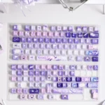 Vibrant Genshin Impact Citlali PBT keycap set, showcasing multiple artistic angles of the exclusive Teyvat Portal design with character details.