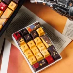 Genshin Impact Chiori PBT Keycap Set displayed from an elegant angle, showcasing intricate fashion-inspired character details and premium PBT material.