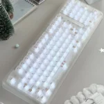 Playful translucent Cherry profile gift bear keycaps, shown from multiple angles, emphasizing their adorable luminous design for a personalized desktop.