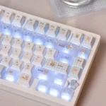Translucent PC gift bear keycap set, Cherry profile. Adorable, whimsical design with luminous charm shown from multiple angles for a playful desktop.