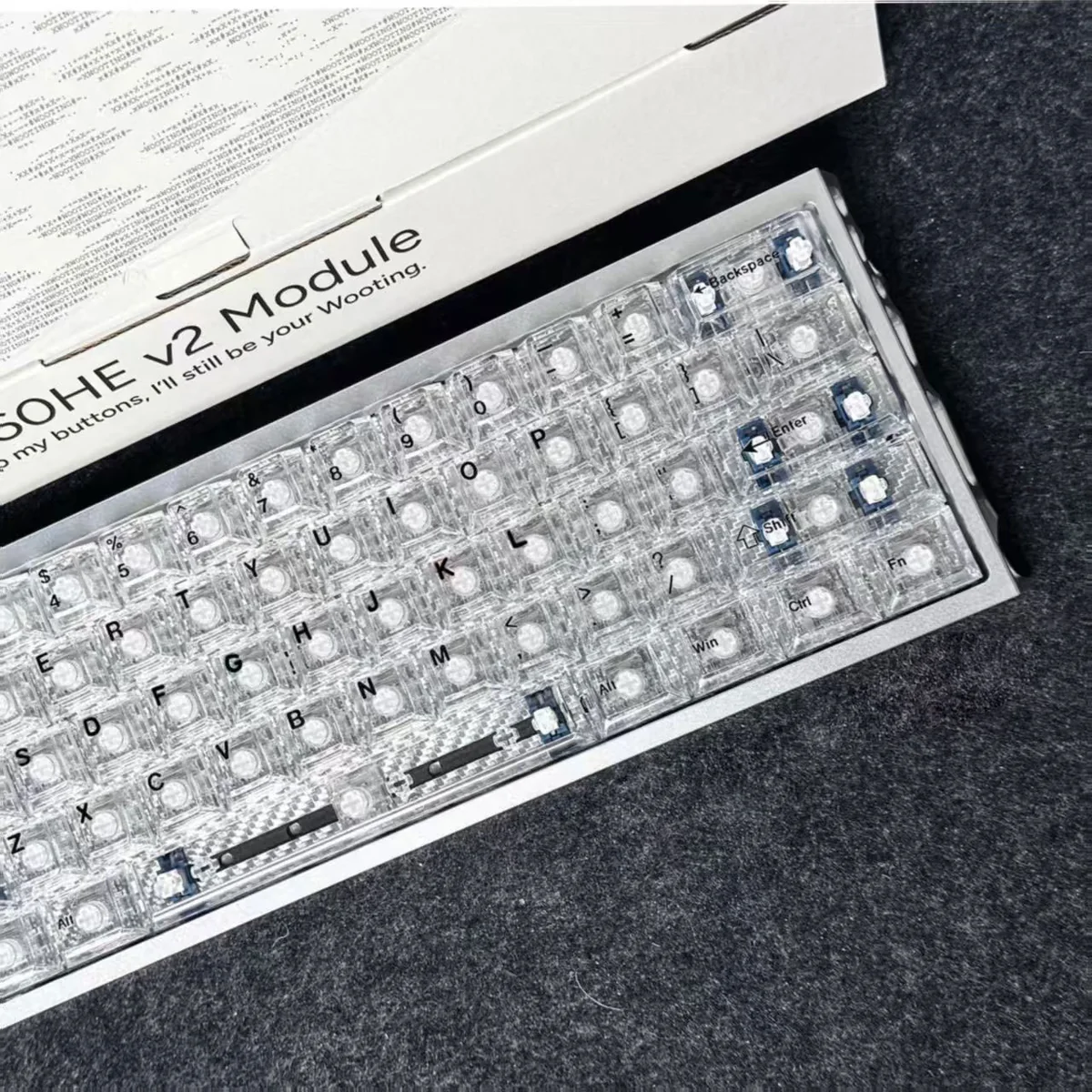 Close-up of Glacier Crystal Top-Printed PC Keycaps set, showcasing its sleek, transparent, crystal-like finish from various angles.