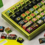 Metallic PBT Urban Graffiti Keycap Set, displaying its vibrant street art designs and bold typography from a dynamic, edgy perspective.