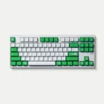 Playful Mischief keycaps in vibrant green double-shot ABS, showcasing quirky custom legends from multiple angles for an energetic display.