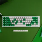 Vibrant green Mischief Keycaps set, crafted from durable double-shot ABS, showcasing playful custom legends for an energetic keyboard aesthetic.