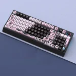 H98 Little Black Dragon MOA Tri-Mode Mechanical Keyboard, showcasing its sleek design, integrated knob, RGB lighting, and hot-swappable switches.