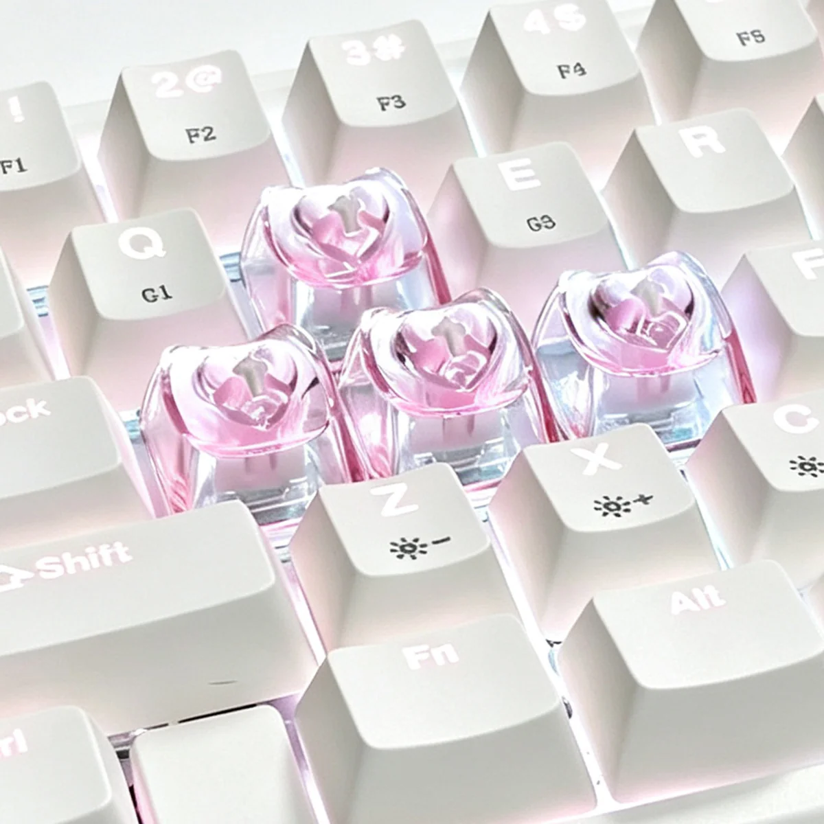 A collection of vibrant luminous heart keycaps for mechanical keyboards, showcasing their polished, translucent design from various artistic angles.