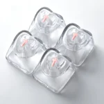 Four vibrant pink translucent heart keycaps for mechanical keyboards, featuring a luminous and polished finish that glows with personalized charm.