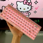 Close-up of cute Hello Kitty MDA jelly keycaps in soft pink and white, showcasing their playful semi-translucent design from various angles.