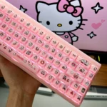 Playful Hello Kitty MDA jelly keycaps in soft pink and white, shown from a different angle, highlighting their cute semi-translucent design.