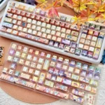 Gallery views of the exclusive Hikaru no Go Hand of God PBT keycaps, showcasing iconic character art and Go board aesthetics from various angles.