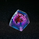 Artisan Hollow Knight Troupe Master Grimm Keycap, intricately detailed from a striking angle, showcasing vibrant transparent resin and premium SA profile.