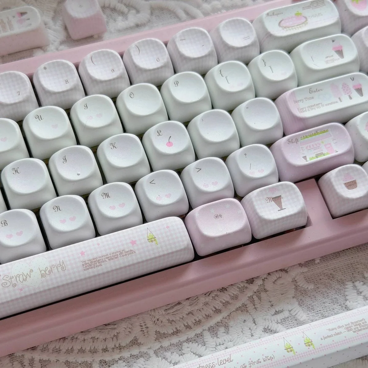 Adorable pink MOA Ice Cream Shop Keycaps from different angles, featuring whimsical dessert themes. Highlights durable PBT material and charming design.