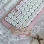 Adorable pink Ice Cream Shop Keycaps, a durable PBT MOA set, are shown from various angles. Whimsical dessert themes create a charming ice cream shop vibe.