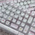 Adorable pink Ice Cream Shop Keycaps set, photographed from multiple angles, featuring whimsical dessert motifs on durable PBT with a smooth MOA profile.