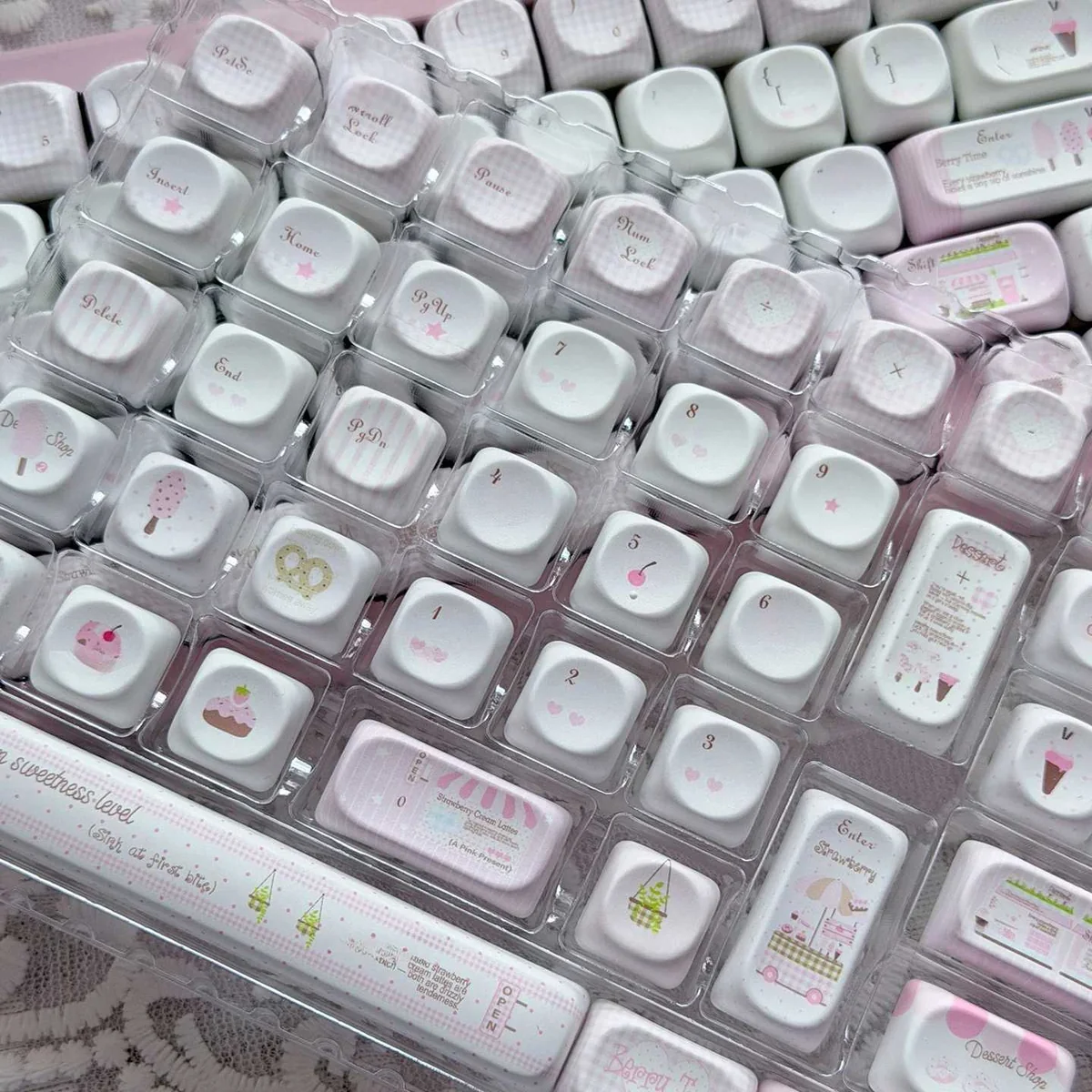 Adorable pink Ice Cream Shop Keycaps set, photographed from multiple angles, featuring whimsical dessert motifs on durable PBT with a smooth MOA profile.