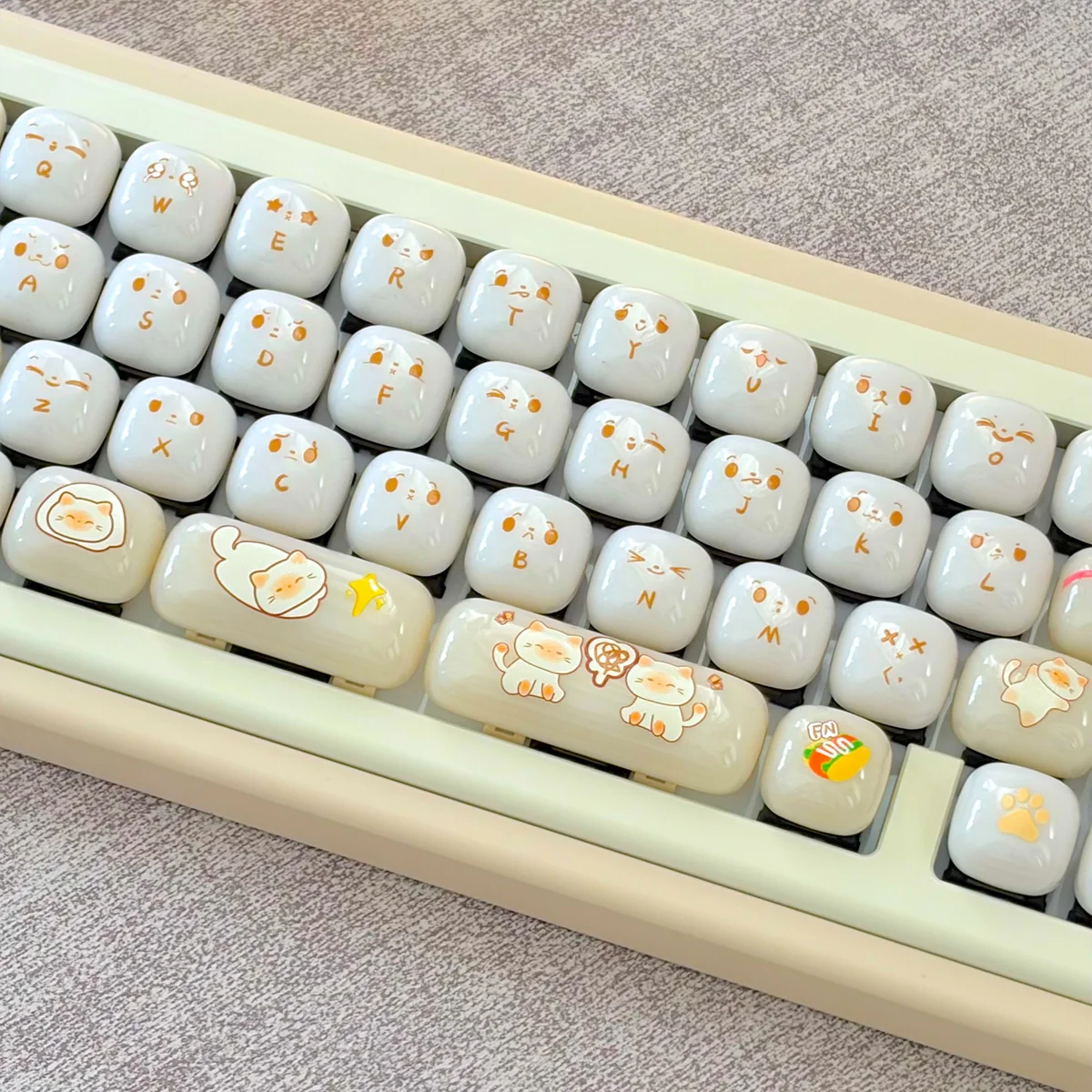 Cat Keycaps Jelly Bun set: Adorable, milky-white, smooth PC keycaps with an ergonomic MOG profile, showcased from various playful angles.