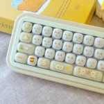 Adorable Cat Keycaps in an ergonomic MOG profile, showcasing their smooth PC jelly bun design from a playful side angle.