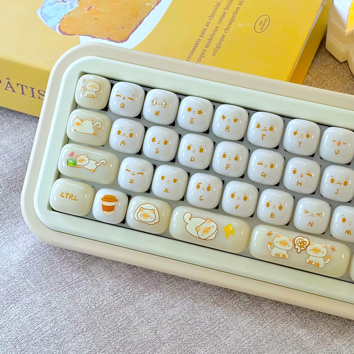 Adorable Cat Keycaps in an ergonomic MOG profile, showcasing their smooth PC jelly bun design from a playful side angle.