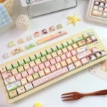 Close-up of the exclusive Kamisama Kiss anime PBT keycap set, showcasing vibrant character art and charming details on the playful keycaps.