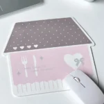 Whimsical Korean house mouse pad from a side angle, revealing its charming pastel urban design and the anti-slip material ensuring stable desk use.