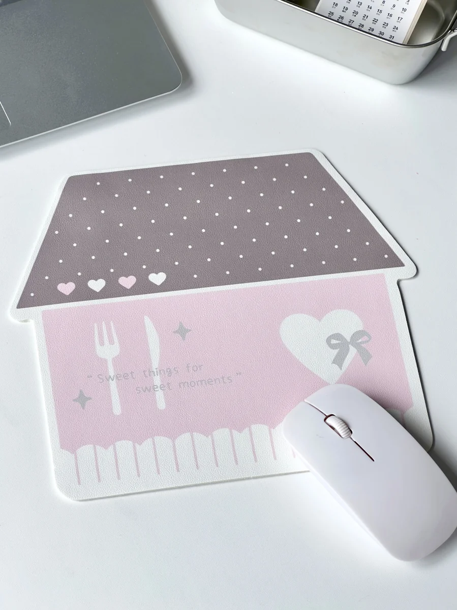 Whimsical Korean house mouse pad from a side angle, revealing its charming pastel urban design and the anti-slip material ensuring stable desk use.