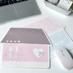 A charming, whimsical Korean house mouse pad, featuring pastel-toned illustrations of a cozy urban landscape. Offers anti-slip comfort for your desk.