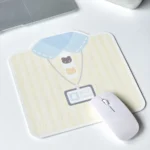 Stylish Korean mouse pad featuring a whimsical shirt design with a cute bear and bow tie motif, showcasing its premium anti-slip surface from a unique design.