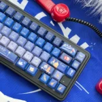 Dreamy La La Land gradient translucent PBT keycap set displayed from multiple artistic angles, showcasing vibrant sunset-inspired colors.
