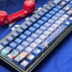 Dreamy La La Land gradient translucent PBT keycaps set showcasing vibrant, artistic colors echoing cinematic sunsets and dreamy cityscapes.