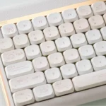 Lemon Cream Low Shaft PBT dye-sub keycaps in soft pastel yellow and cream. Various angles showcase playful, fresh, minimalist design.