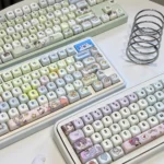 Exclusive Love and Deepspace Zayne & Rafayel & Xavier PBT keycaps, featuring elegant character designs and a smooth, jade-like finish, presented from a distinct angle.