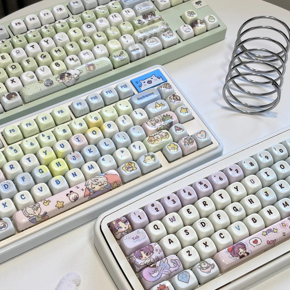 Exclusive Love and Deepspace Zayne & Rafayel & Xavier PBT keycaps, featuring elegant character designs and a smooth, jade-like finish, presented from a distinct angle.
