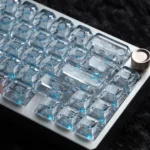 Ice Soul luminous PC keycaps in crystal blue, showcasing the ASA profile from multiple angles with an ethereal glow.