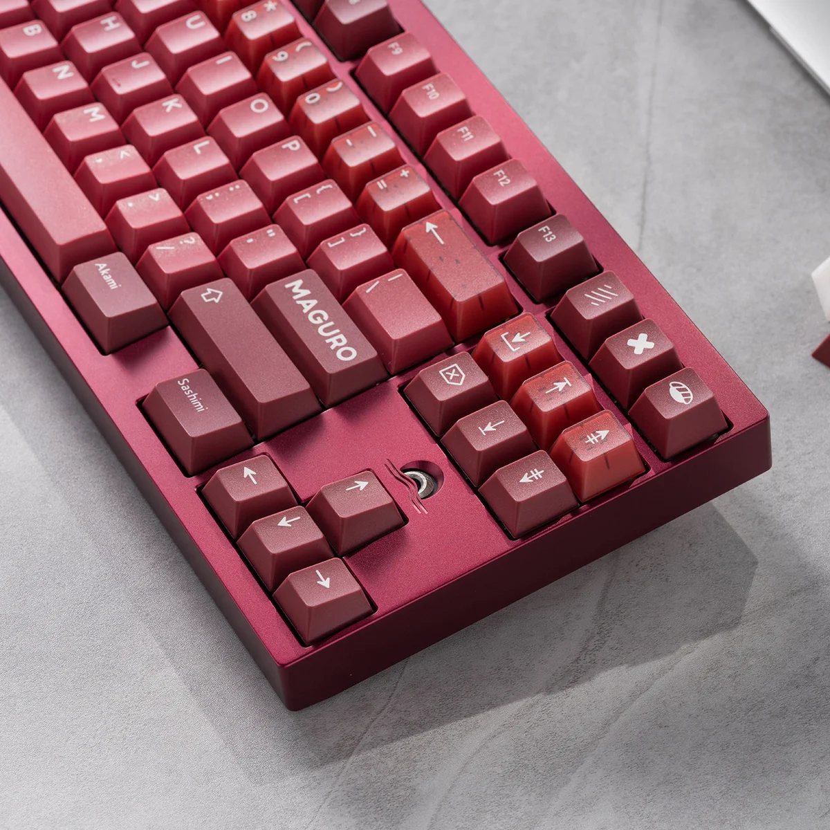 Maguro Tuna PBT Keycaps in various views, highlighting premium doubleshot PBT and the bold red, white, and black iconic Maguro design, evoking culinary art for your mechanical keyboord.