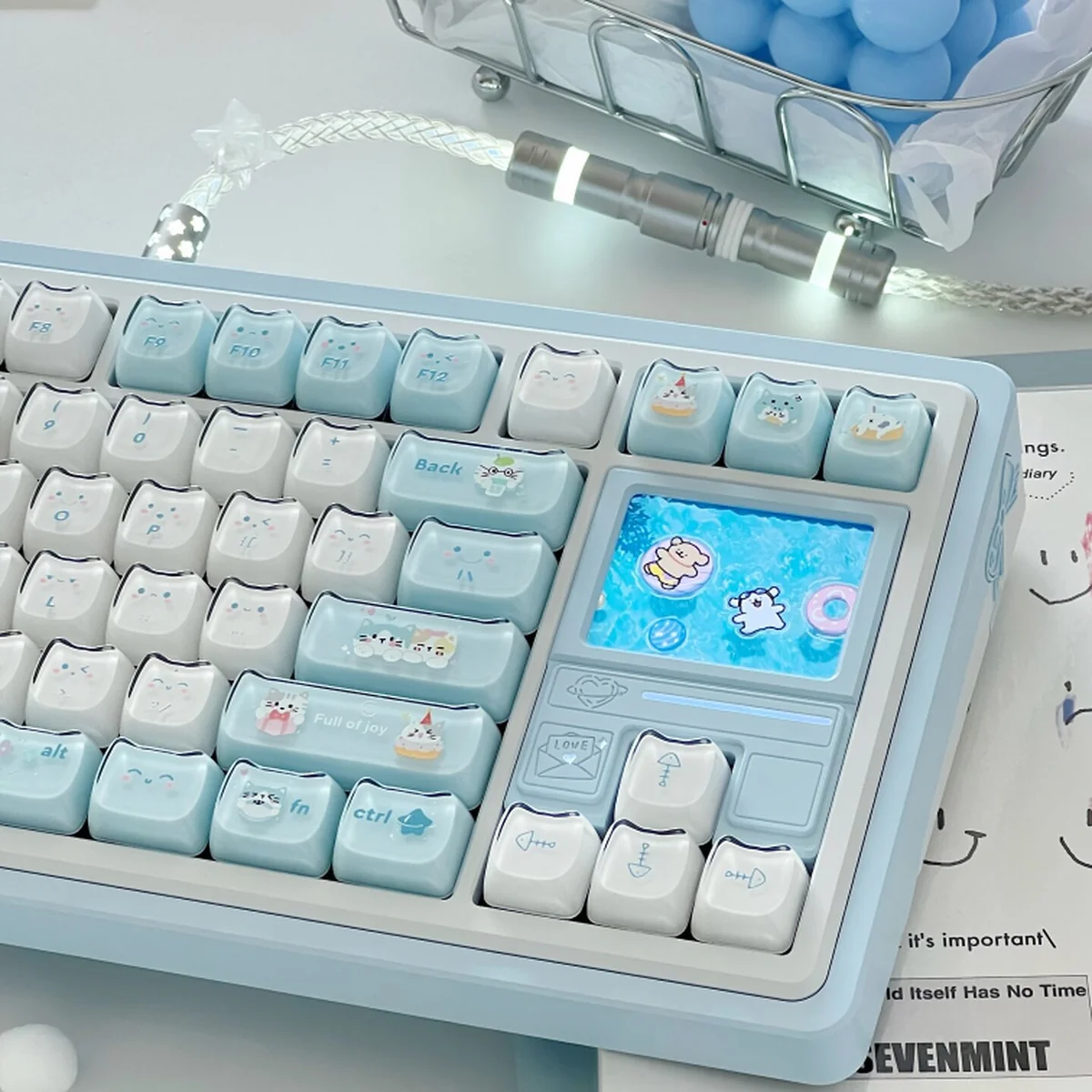Explore various angles of the ergonomic MAO Keycap Set, revealing its playful jelly cat paradise aesthetic with soft blue and white keys.