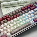 Artistic Milky Bear PBT keycaps from diverse angles, showcasing unique translucent legends and captivating light effects.