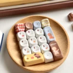 A collection of whimsical jade translucent bear MOA keycaps, showcasing the unique translucent jade-like resin and charming bear illustrations from various angles.
