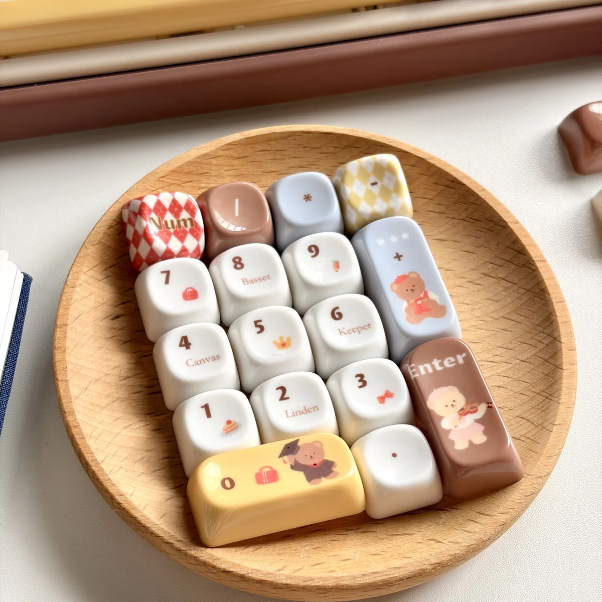 A collection of whimsical jade translucent bear MOA keycaps, showcasing the unique translucent jade-like resin and charming bear illustrations from various angles.
