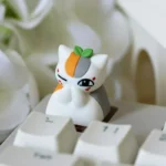 Playful Madara artisan keycap gallery, revealing intricate craftsmanship and vibrant anime colors from every angle. An exclusive setup.