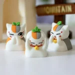 Charming Madara artisan keycap. This exclusive, vibrant anime Nyanko-sensei keycap playfully depicts him covering his eyes.
