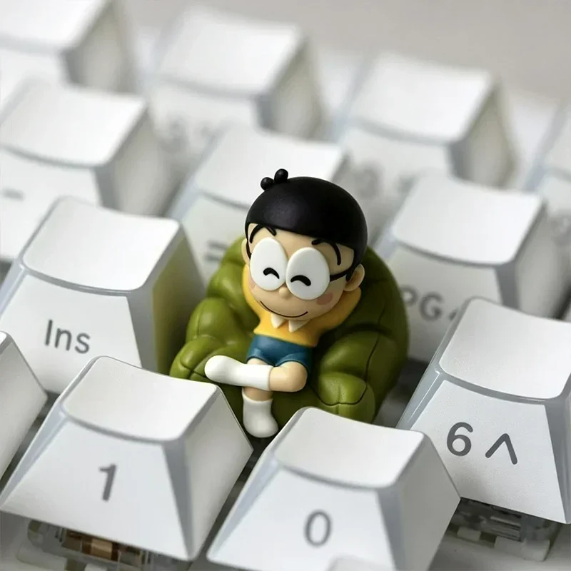 Whimsical Nobita Nobi Keycap for ESC, showcasing his iconic innocent expression with vibrant cartoon design. A charming custom keyboard accessory.
