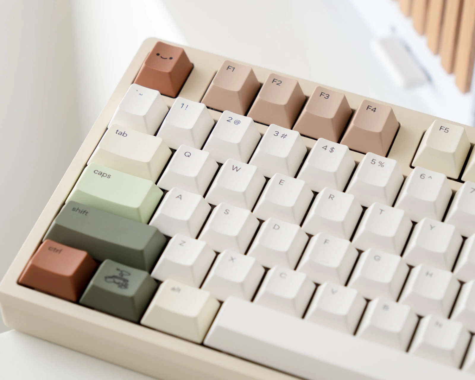 Osume Zen keycaps photographed from an angle in a warm minimalist workspace