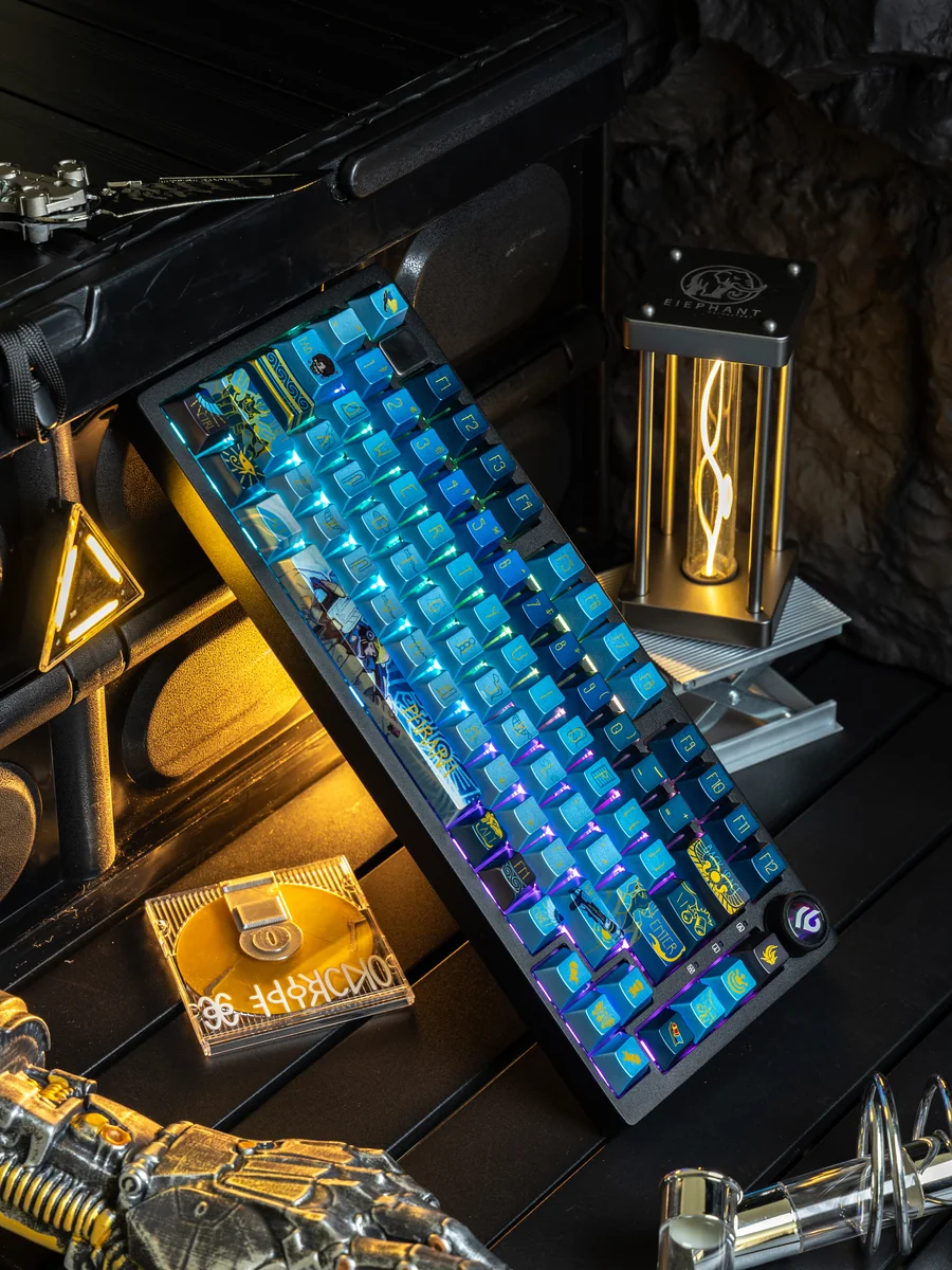 An exclusive Overwatch Pharah PBT keycap, revealing its unique side-engraved art and metallic paint finishes from a premium, detailed perspective.