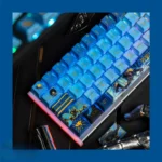 Gallery view of the premium Overwatch Pharah PBT keycap, showcasing its side-engraved art and unique metallic paint accents from various angles.
