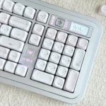 Miffy & Friends PBT dye-sub keycaps. Whimsical characters, soft colors, and clean lines from various angles, creating playful charm.