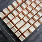 Custard Yellow PBT Double-Shot Keycaps, showing durable PBT, crisp double-shot legends, and warm custard-cream tones.