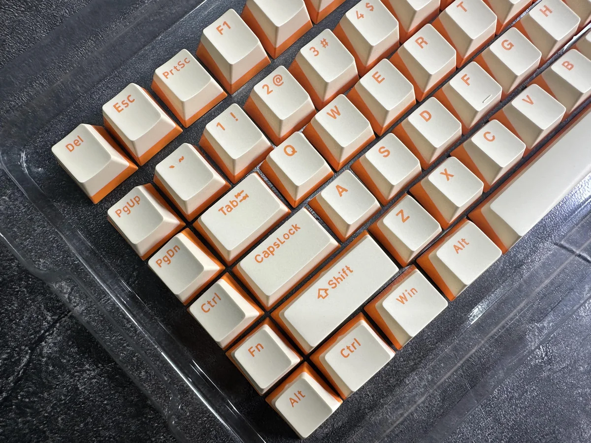 Custard Yellow PBT Double-Shot Keycaps, showing durable PBT, crisp double-shot legends, and warm custard-cream tones.